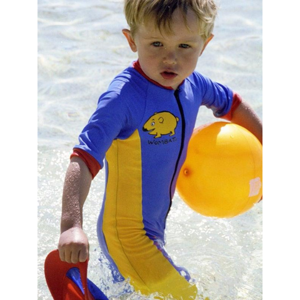 a little boy wearing our ozi varmints all in one zip swimsuit