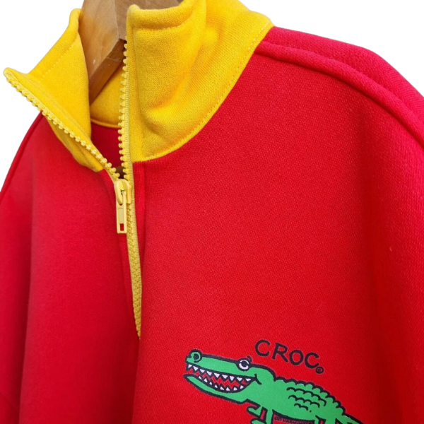ozi varmints zip front fleece sweat shirt with red/yellow colour and a crocodile design print, closer view